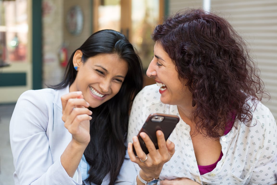 Companions Laughing at Texts